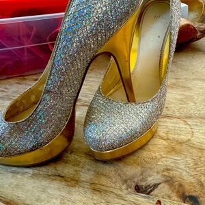 4 inch heels only worn twice. Gold and sparkling